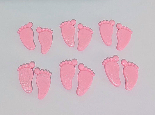 Pink baby feet, edible fondant cake decorations.