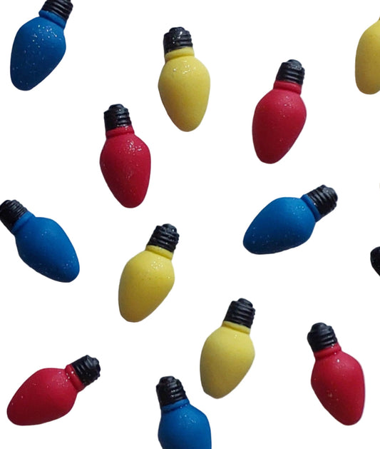 Colorful Christmas light bulb figurines on a white background