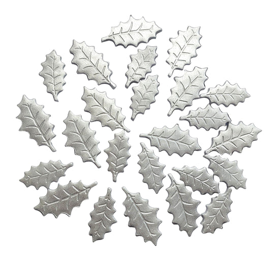 Silver holly leaf-shaped decorations on a white background