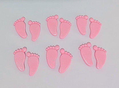 Pink baby feet, edible fondant cake decorations.