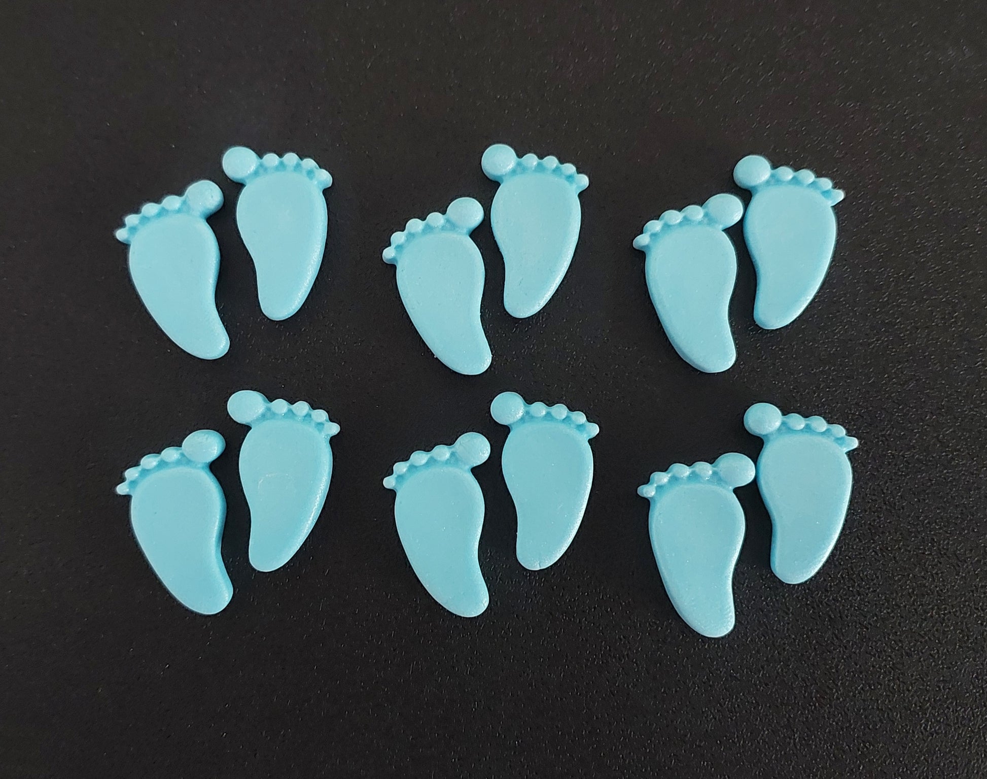 Blue baby feet, edible fondant icing cake decorations.