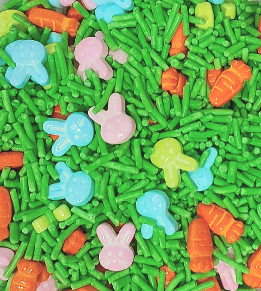 Colorful Easter-themed sprinkles including green sticks, bunnies, and carrots.