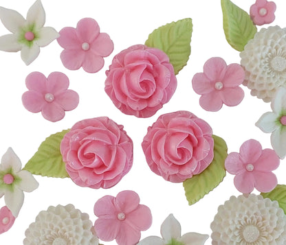 Assorted sugar flowers and leaves in pink and white colours, edible cake decorations