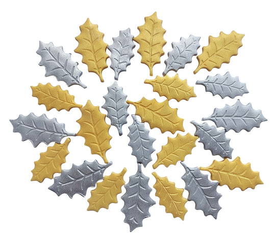 Gold and silver holly leaf-shaped decorations on a white background