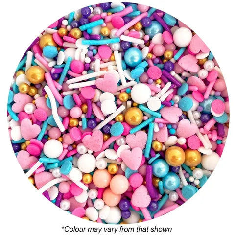 Assorted colorful cake sprinkles including hearts, pearls, and sticks on a white background.