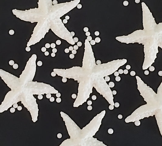 six white starfish, edible fondant icing cake decorations with sugar pearls
